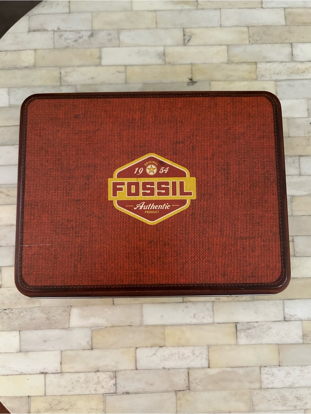Fossil wine accessory set featuring a corkscrew, stopper, and charms